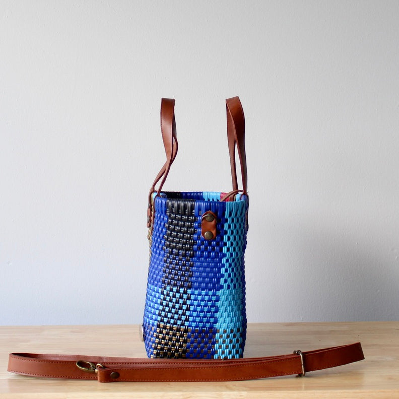 Lifestyle flat lay of colorful handmade Mexican purse – artisan tote