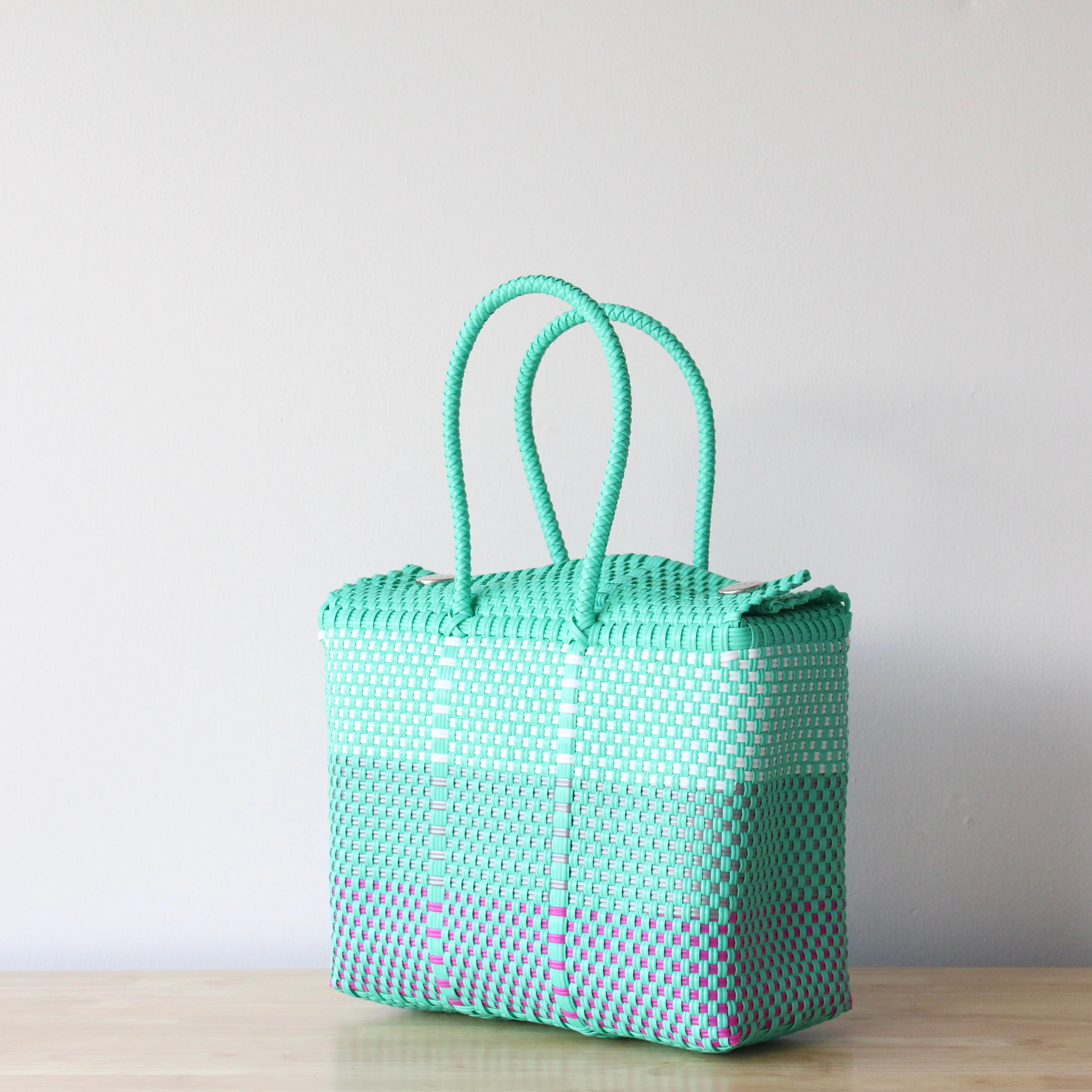 Artisan-made Mexican handbag in aqua, white and fuchsia colors