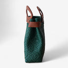 Eco-friendly emerald tote with leather handles for everyday use