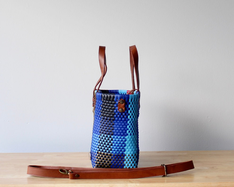 Lifestyle flat lay of colorful handmade Mexican purse – artisan tote