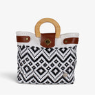 Carmen black and white diamond Mexican basket bag with natural wood handles, front view