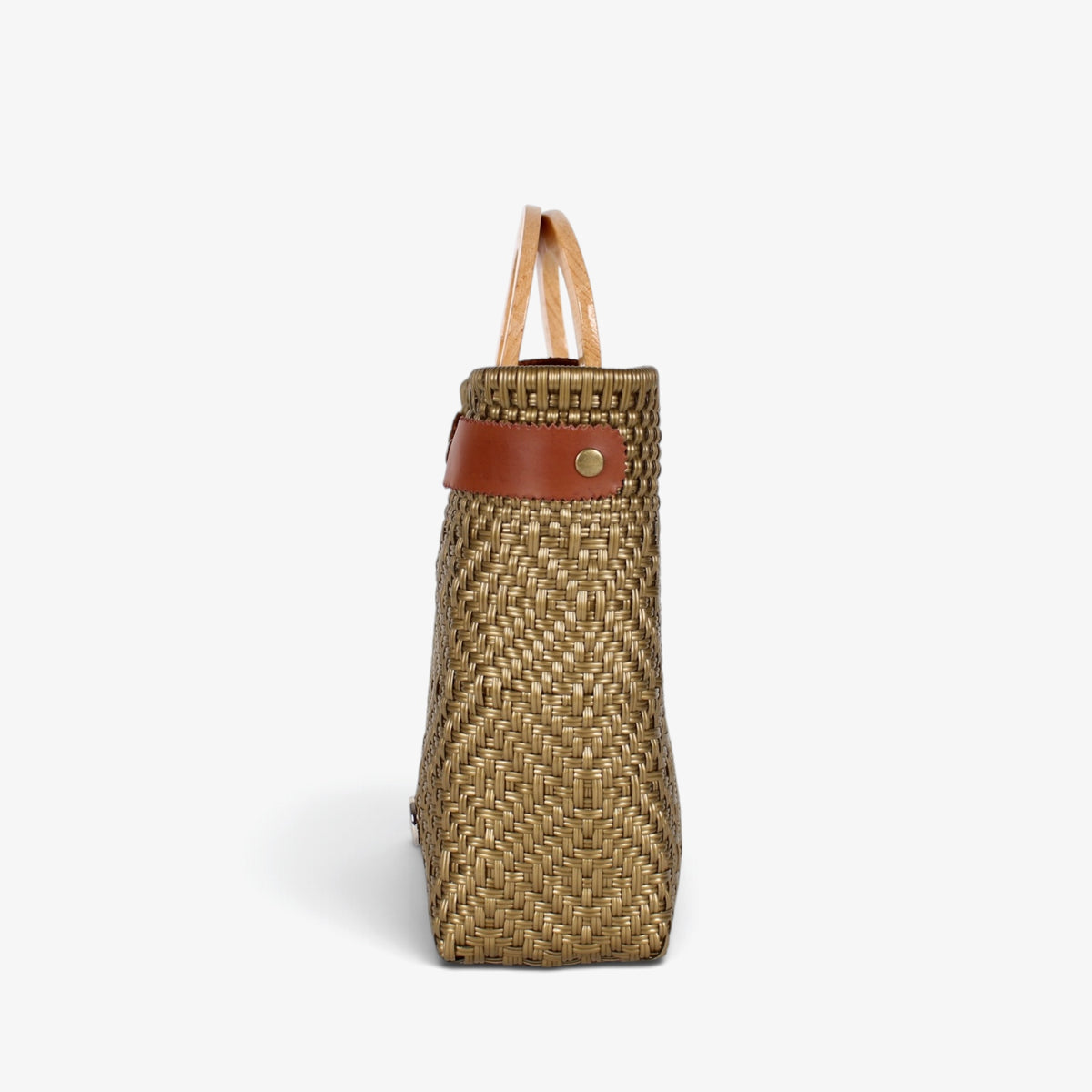 Side view of the gold basket bag showing its adjustable leather side strap
