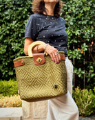Gold Carmen Mexican basket bag with wood handles, lifestyle photo