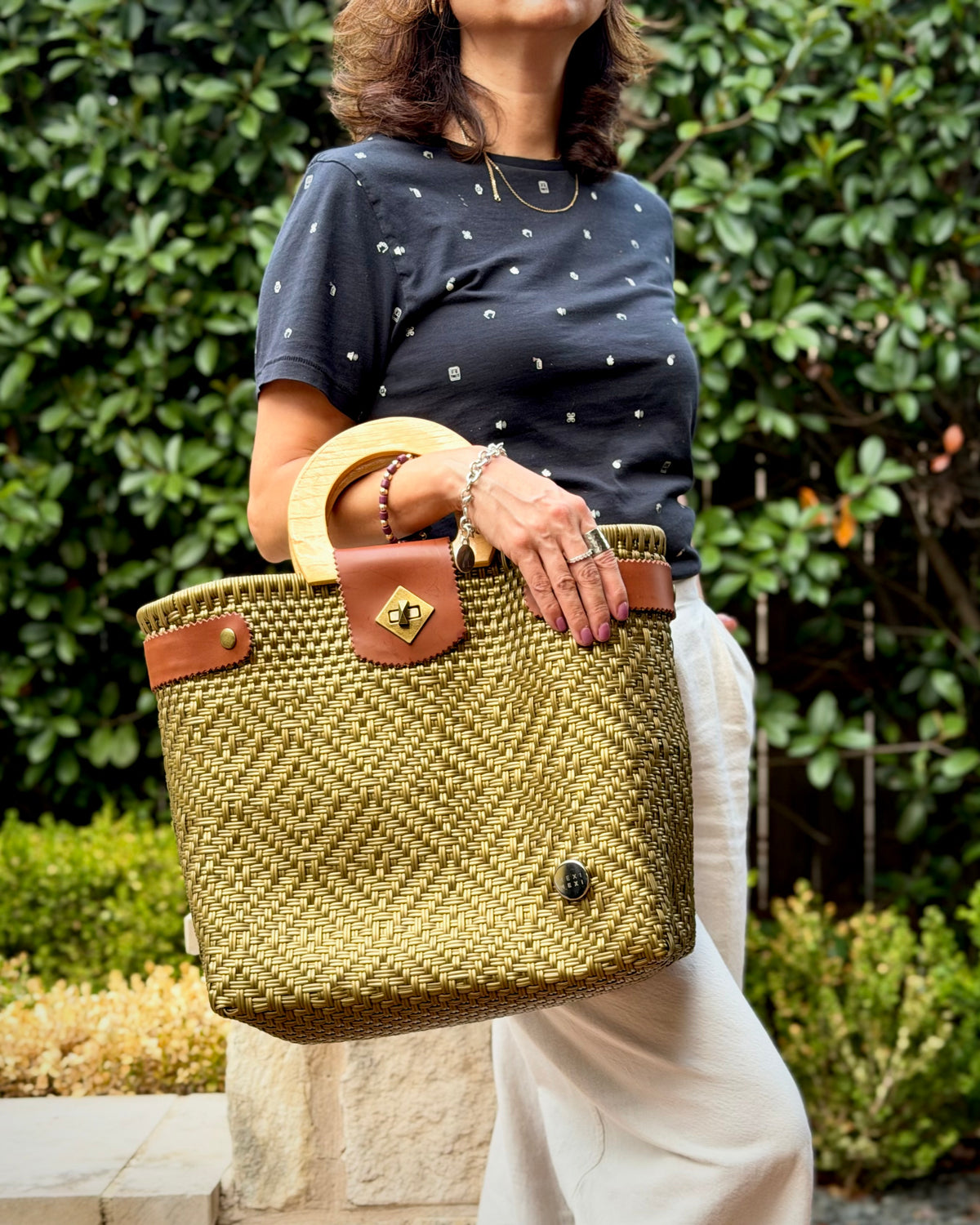 Gold Carmen Mexican basket bag with wood handles, lifestyle photo