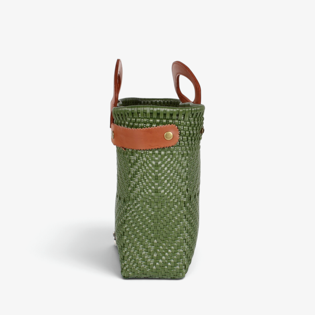 Side view of the olive green woven tote showing its adjustable leather side strap