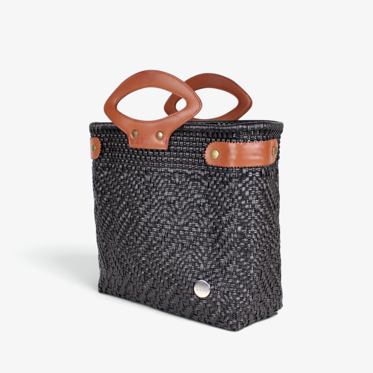 Charcoal handwoven tote with brown genuine leather handles and snap side straps, angled view