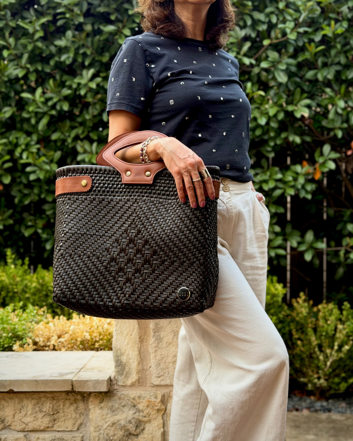 Chocolate Brown Laura Maria Mexican basket tote with brown leather handles, lifestyle photo
