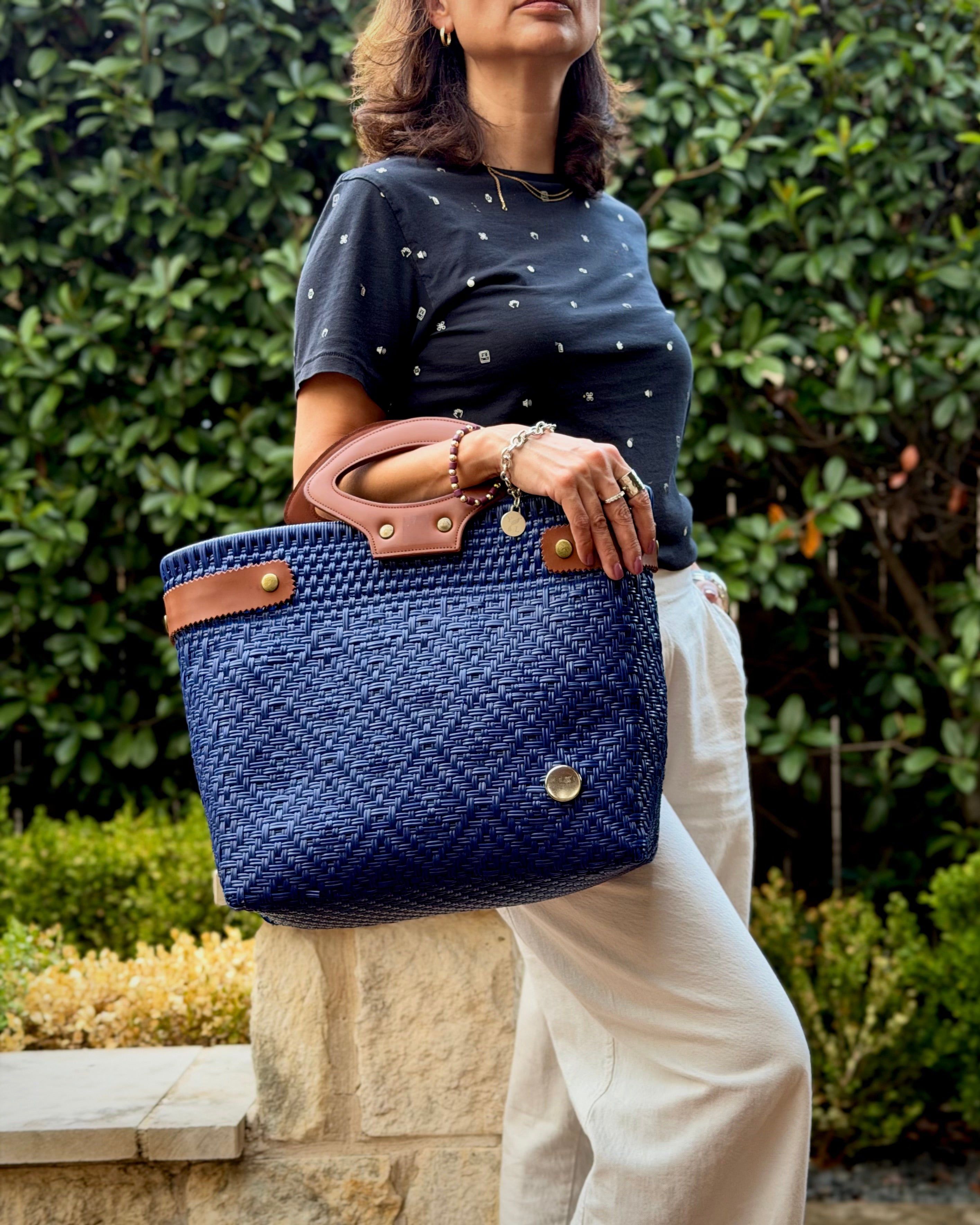Royal Blue Laura Maria Mexican basket tote with brown leather handles, lifestyle photo