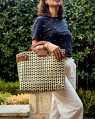 Black & Cream Check Laura Maria Mexican basket tote with brown leather handles, lifestyle photo