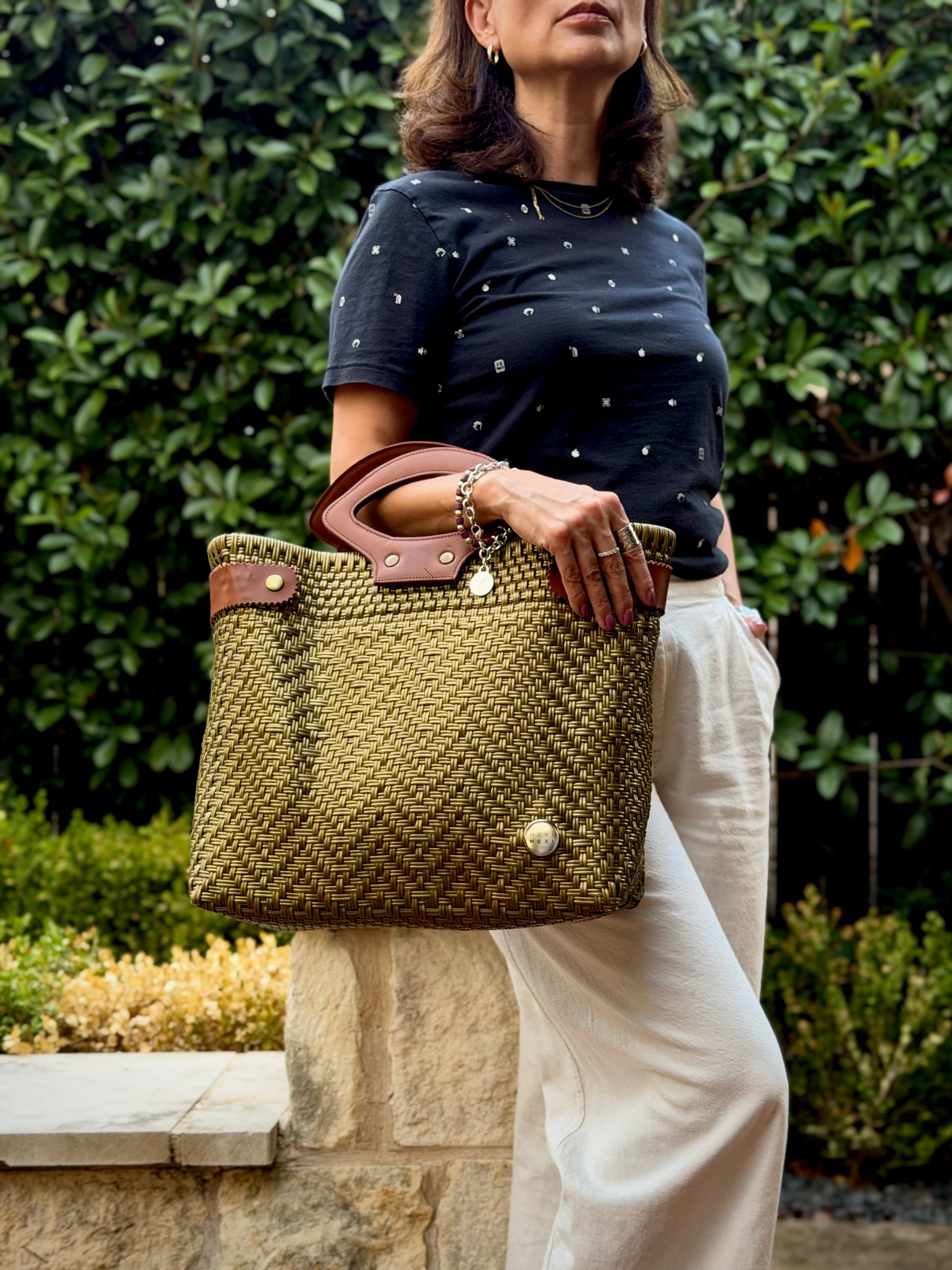 Bronze Laura Maria Mexican basket tote with brown leather handles, lifestyle photo