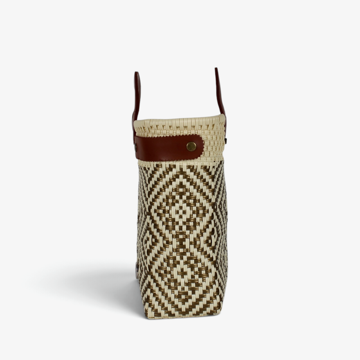 Side view of the natural diamond-pattern tote showing its adjustable leather side strap