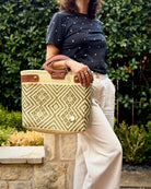 Natural Diamond Laura Maria Mexican basket tote with brown leather handles, lifestyle photo