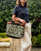 Black & Ivory Diamond Laura Maria Mexican basket tote with brown leather handles, lifestyle photo