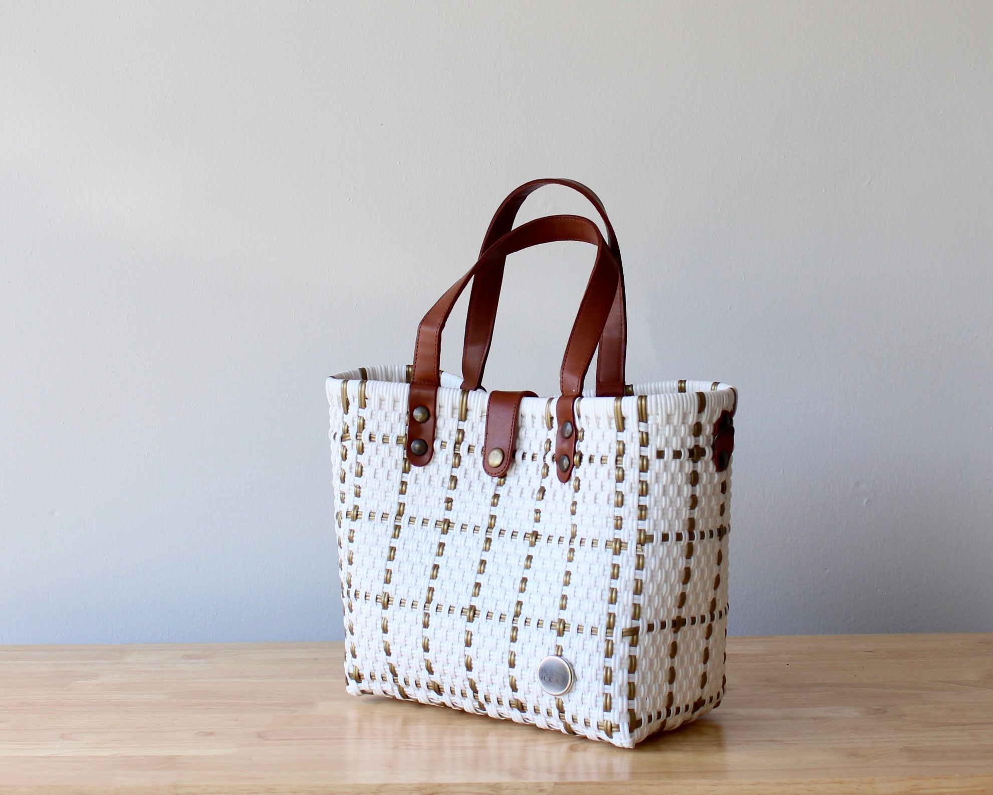 Eco-friendly woven purse in white with earthy accents