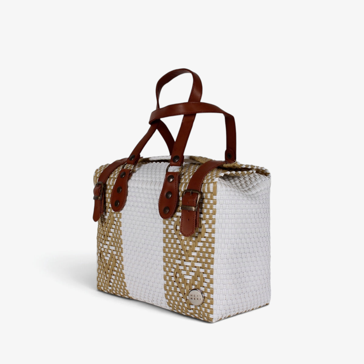 White and gold handwoven handbag with brown genuine leather handles and brass-tone hardware, angled view