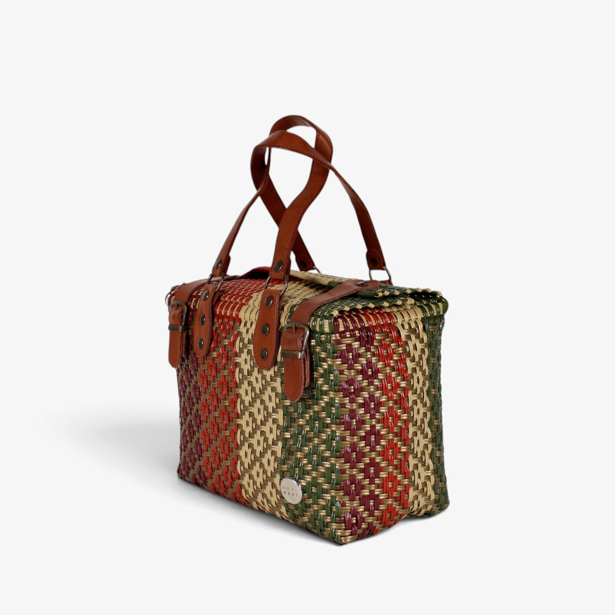 Earth tones handwoven handbag with brown genuine leather handles and brass-tone hardware, angled view
