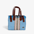 Theresa light blue Mexican handbag with brown genuine leather handles, front view