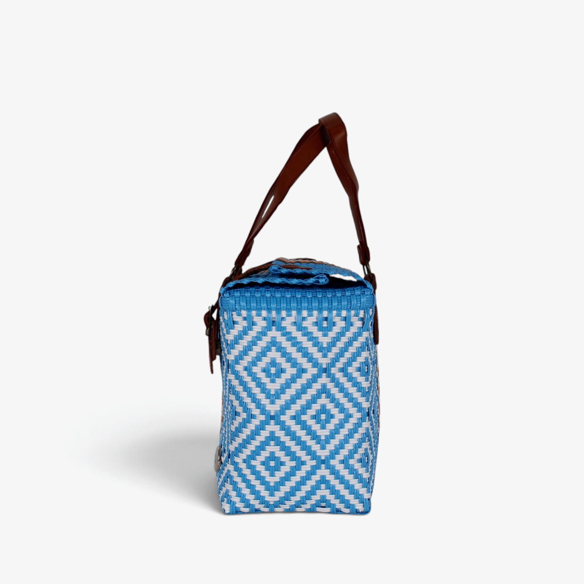 Side view of the light blue woven handbag with leather flap and snap closure