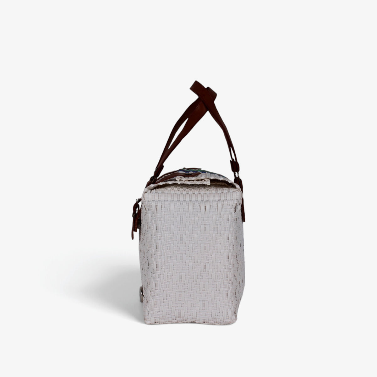 Side view of the white rainbow stripe woven handbag with leather flap and snap closure