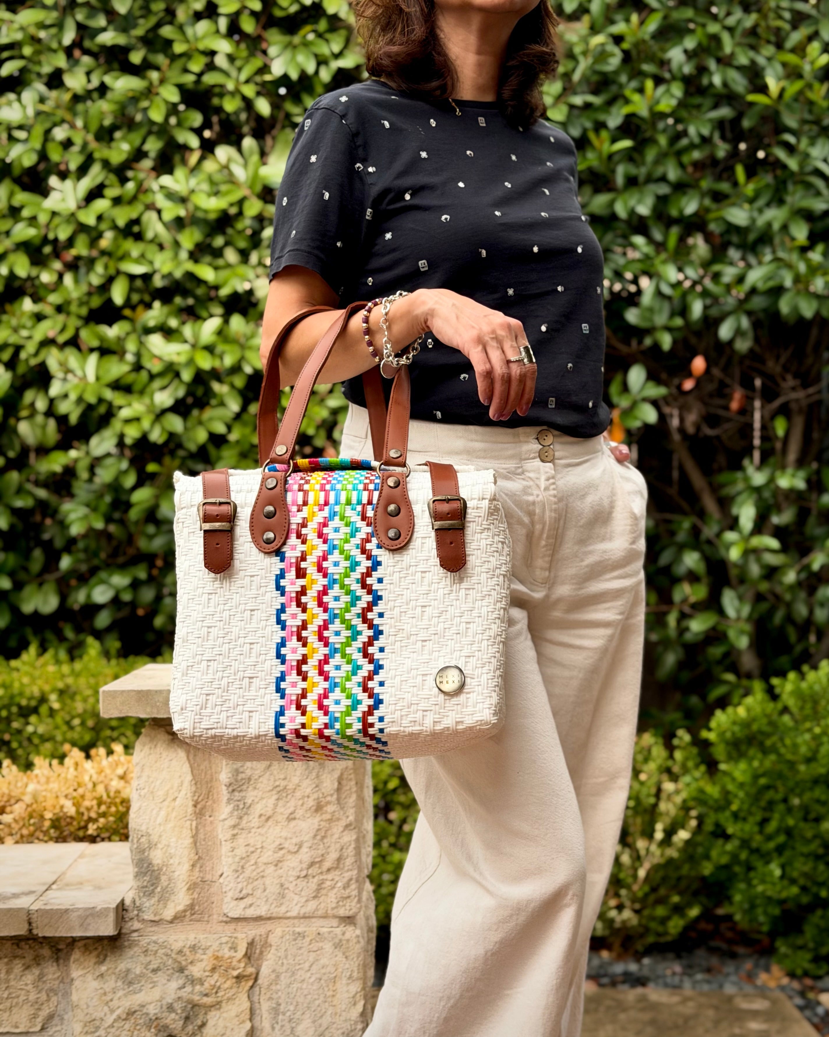White Rainbow Stripe Theresa Mexican handbag with brown leather handles, lifestyle photo