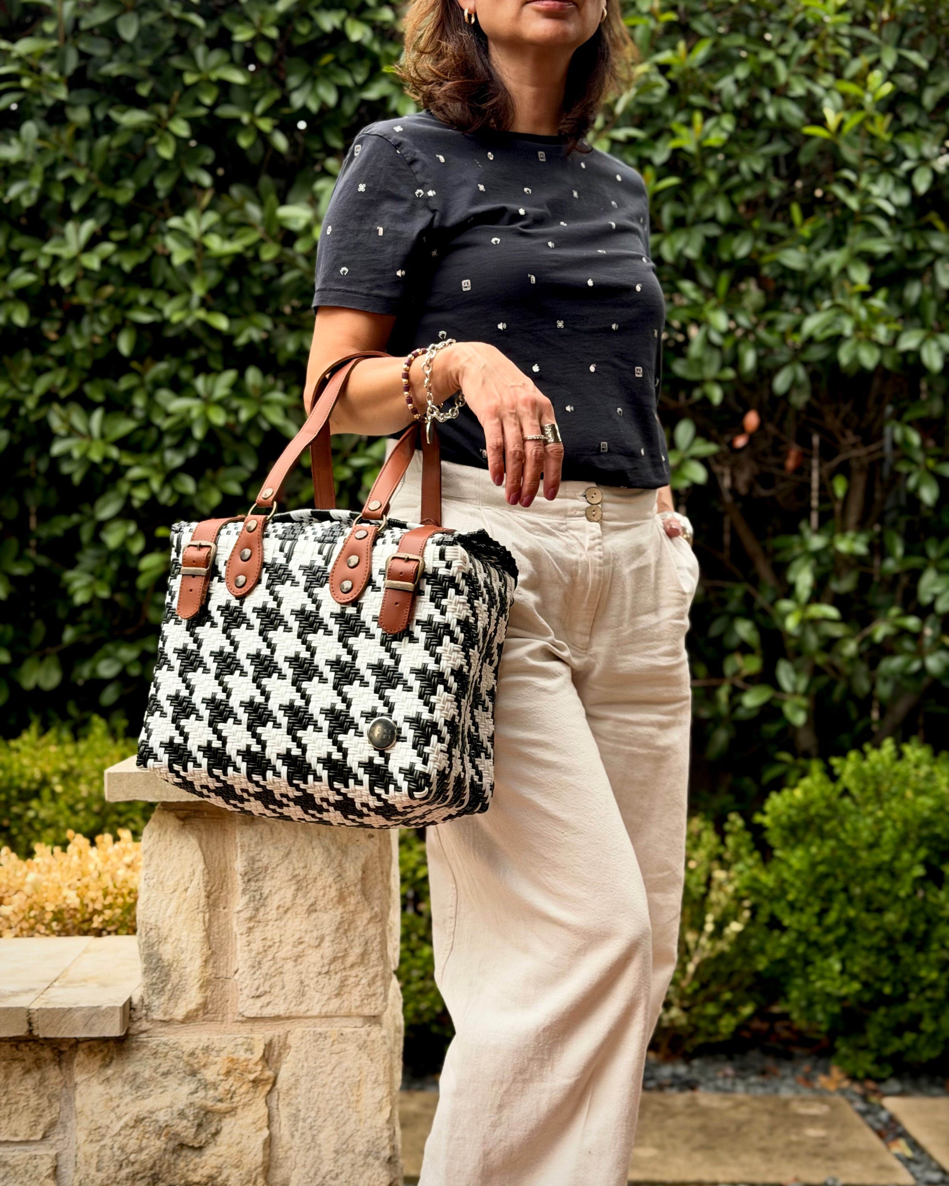 Black & White Houndstooth Theresa Mexican handbag with brown leather handles, lifestyle photo