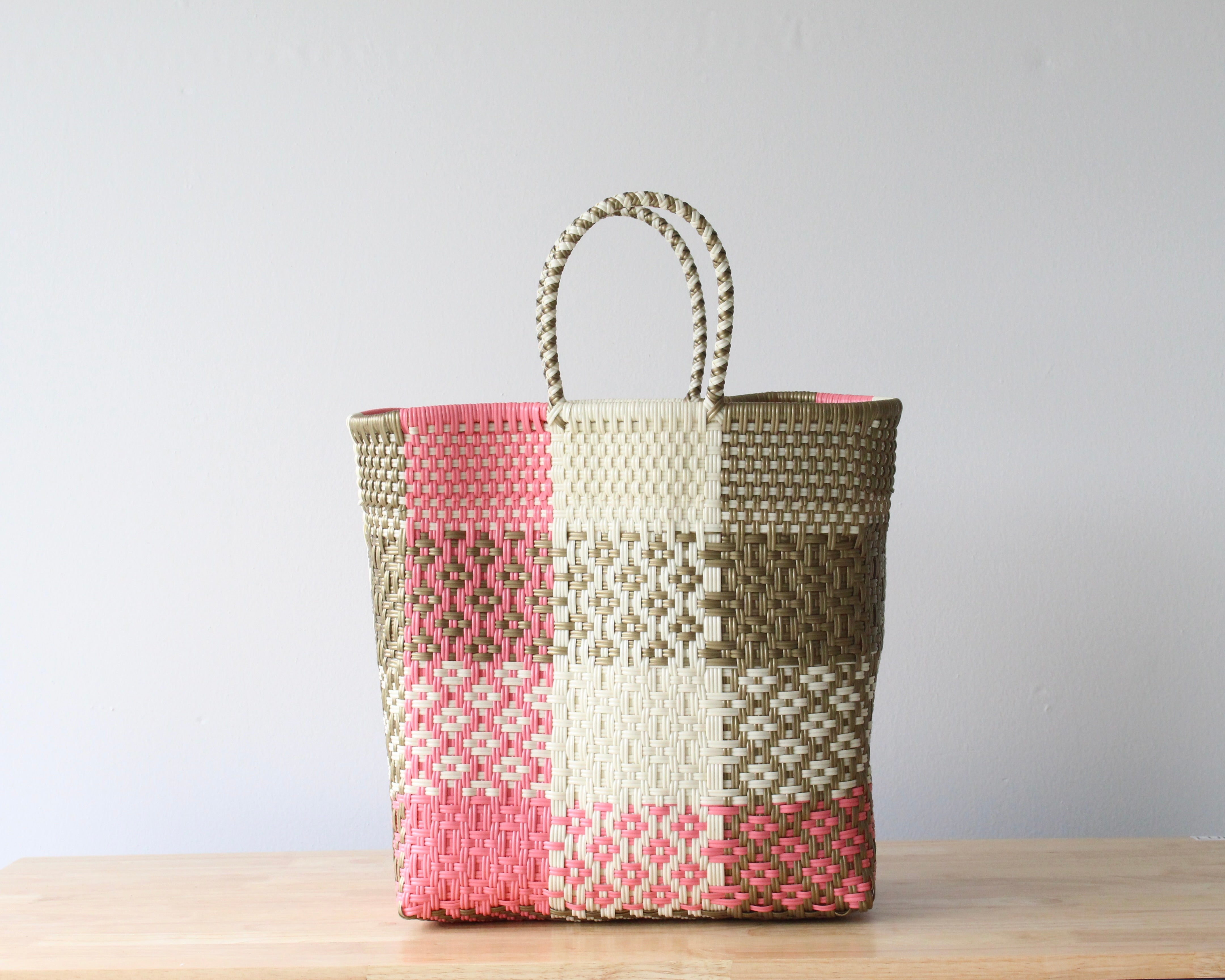 Handwoven Mexican medium tote bag in pink and neutral colors made from recycled plastic