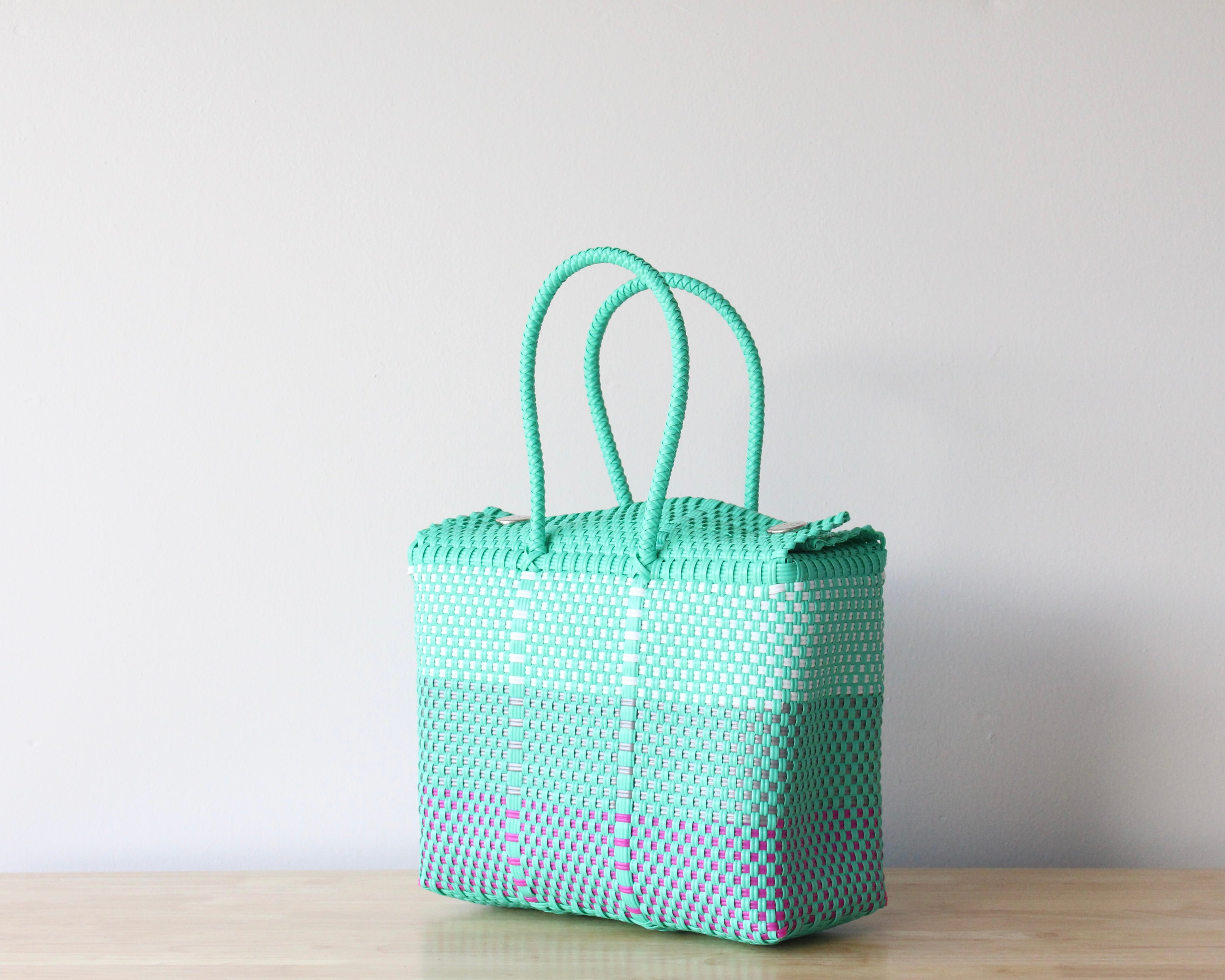 Artisan-made Mexican handbag in aqua, white and fuchsia colors