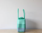 Colorful MexiMexi handbag with snap closure and woven plastic design