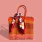 Orange MexiMexi Handbag with White Camellia Furoshiki