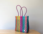 Side view of colorful handwoven Mexican tote bag — one-of-a-kind artisan bag by MexiMexi