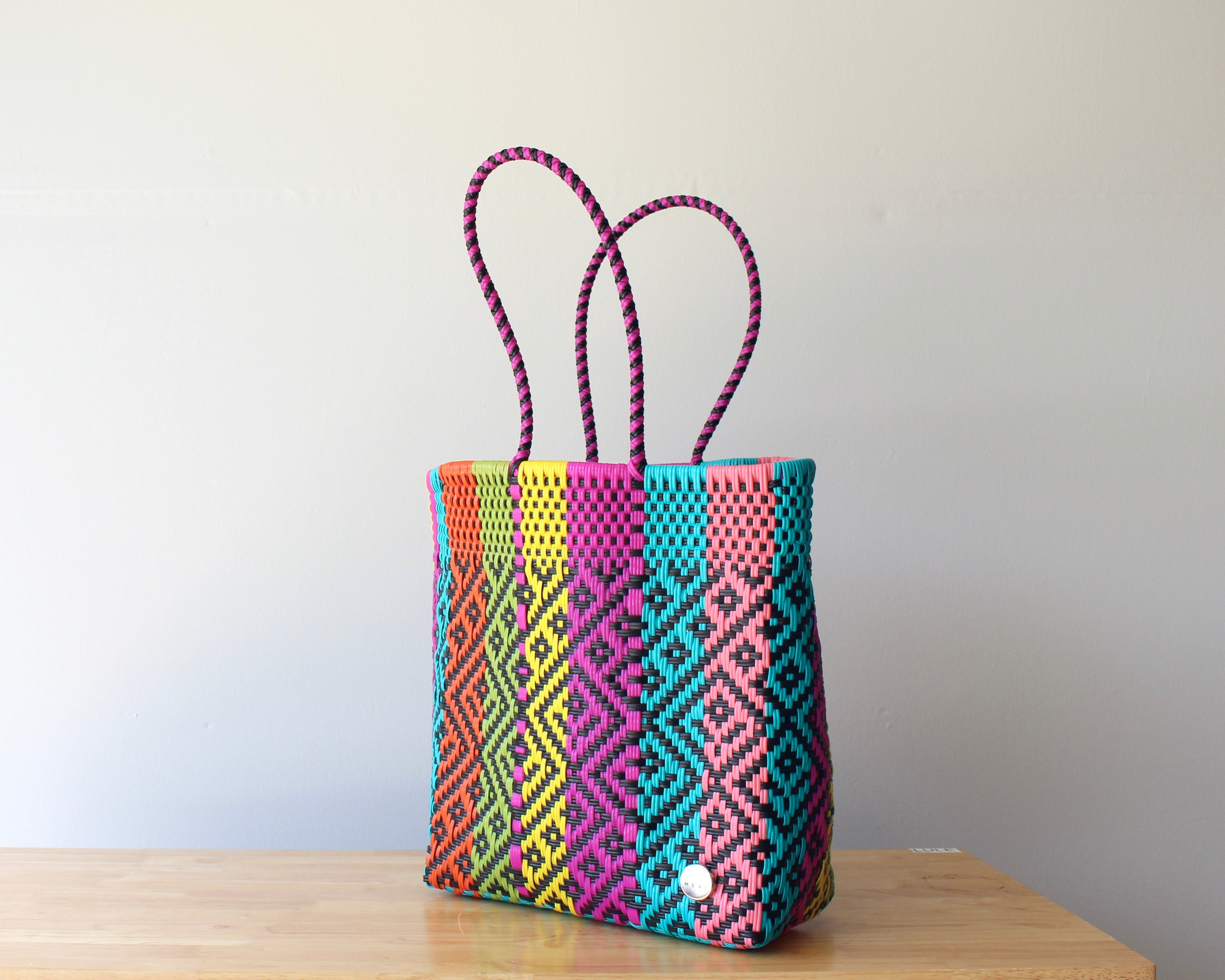 Side view of colorful handwoven Mexican tote bag — one-of-a-kind artisan bag by MexiMexi