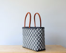 Diagonal view of navy and white geometric woven tote — waterproof artisan bag by MexiMexi