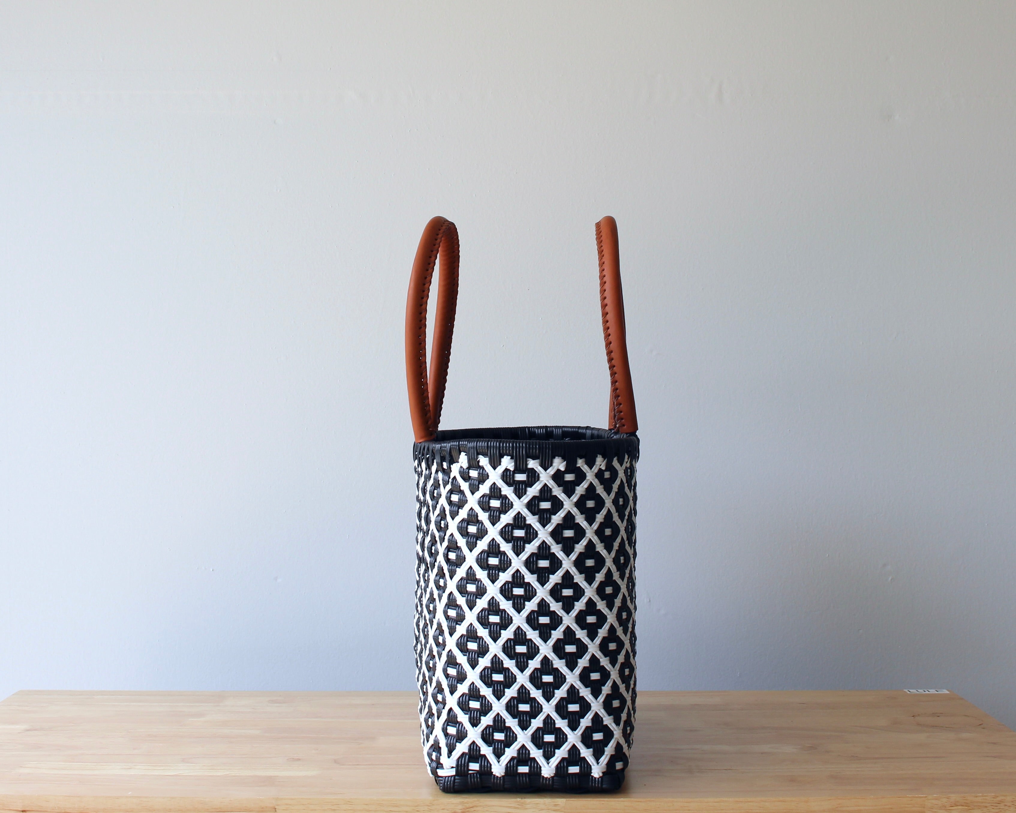 Side view of navy diamond handwoven Mexican tote — one-of-a-kind artisan bag by MexiMexi