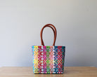 Handwoven Mexican tote bag in hot pink and multicolor — artisan woven by MexiMexi