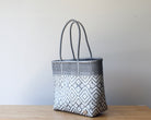 Diagonal view of smoke gray woven tote bag — waterproof artisan bag by MexiMexi