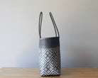 Side view of gray geometric handwoven Mexican tote — one-of-a-kind artisan bag by MexiMexi