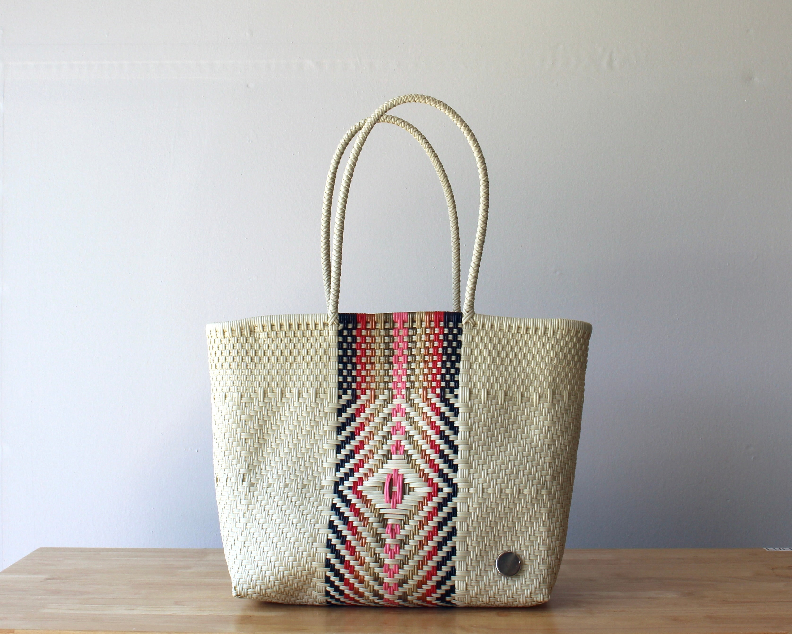 Handwoven Mexican tote bag in the beige and rose diamond pattern — artisan woven by MexiMexi