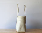 Side view of the rose diamond handwoven Mexican tote — one-of-a-kind artisan bag by MexiMexi