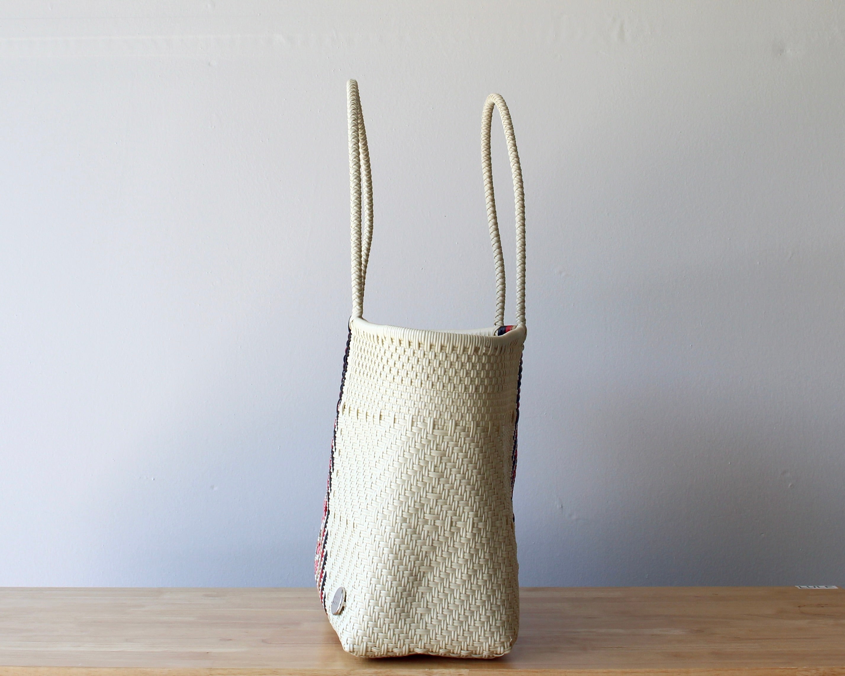 Side view of the rose diamond handwoven Mexican tote — one-of-a-kind artisan bag by MexiMexi