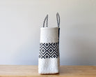 Side view of black and white check handwoven Mexican tote — one-of-a-kind artisan bag by MexiMexi