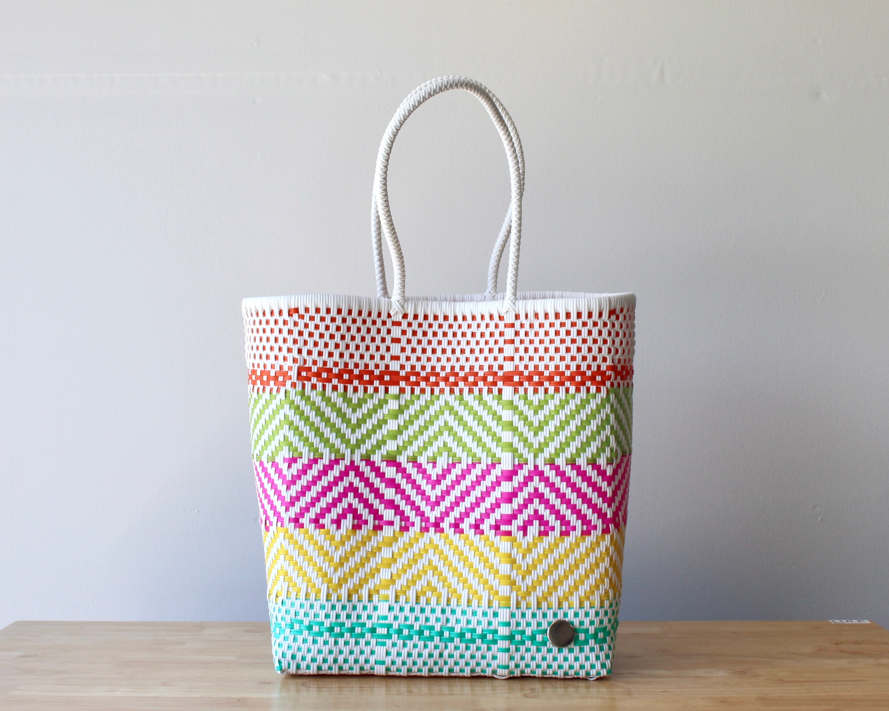 Handwoven Mexican tote bag in pastel pink, yellow and green stripes — artisan woven by MexiMexi