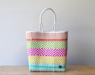Handwoven Mexican tote bag in pastel pink, yellow and green stripes — artisan woven by MexiMexi