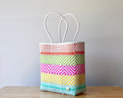 Diagonal view of striped woven artisan tote — waterproof Mexican bag by MexiMexi