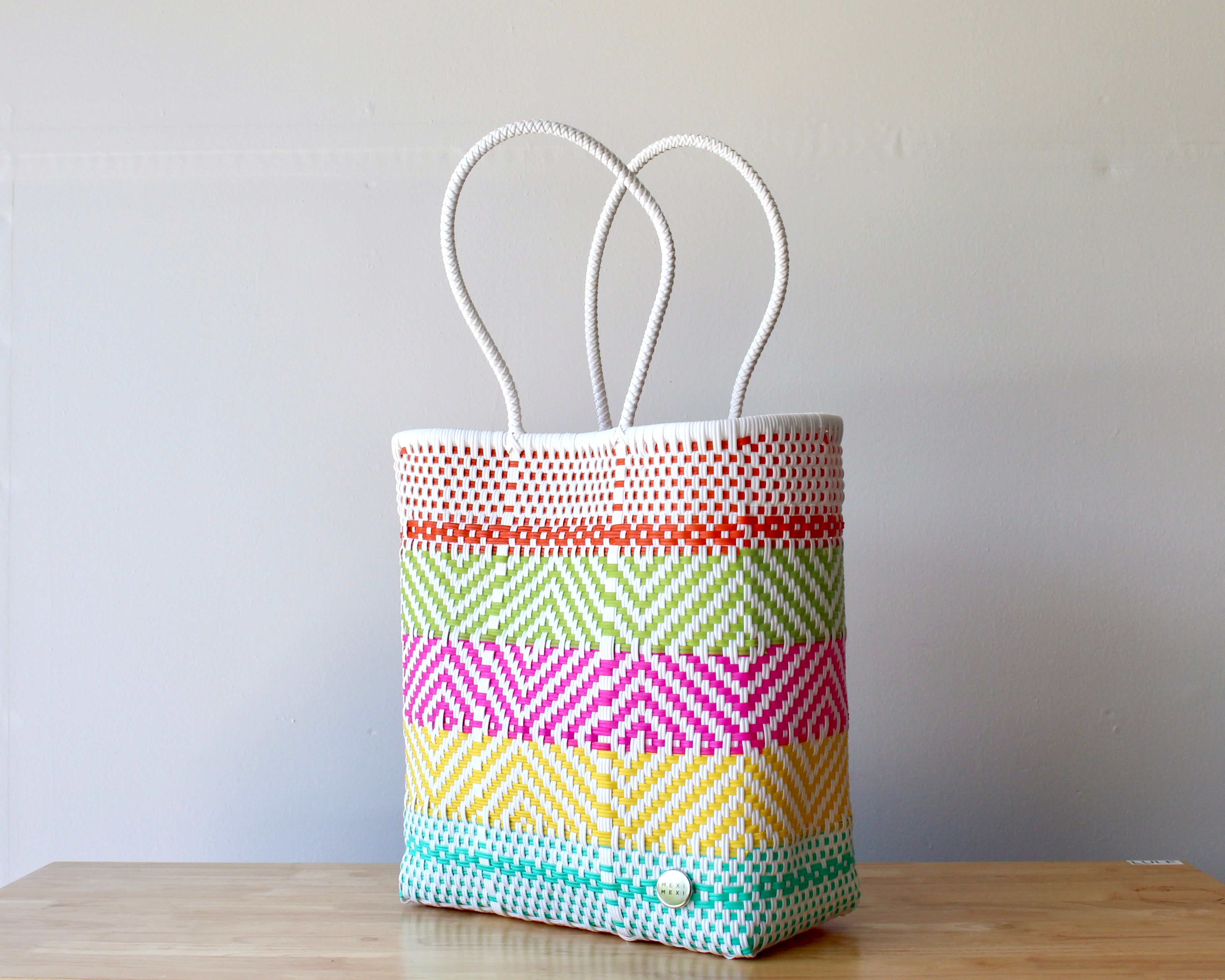 Diagonal view of striped woven artisan tote — waterproof Mexican bag by MexiMexi