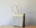 Diagonal view of the ivory artisan woven tote — waterproof Mexican bag by MexiMexi
