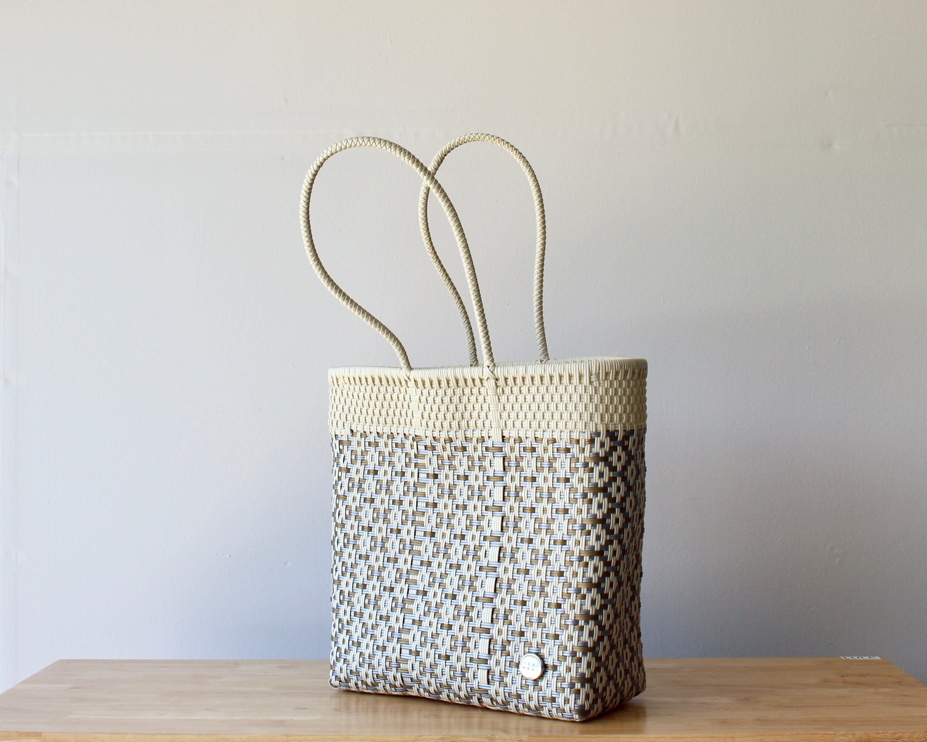 Diagonal view of the ivory artisan woven tote — waterproof Mexican bag by MexiMexi