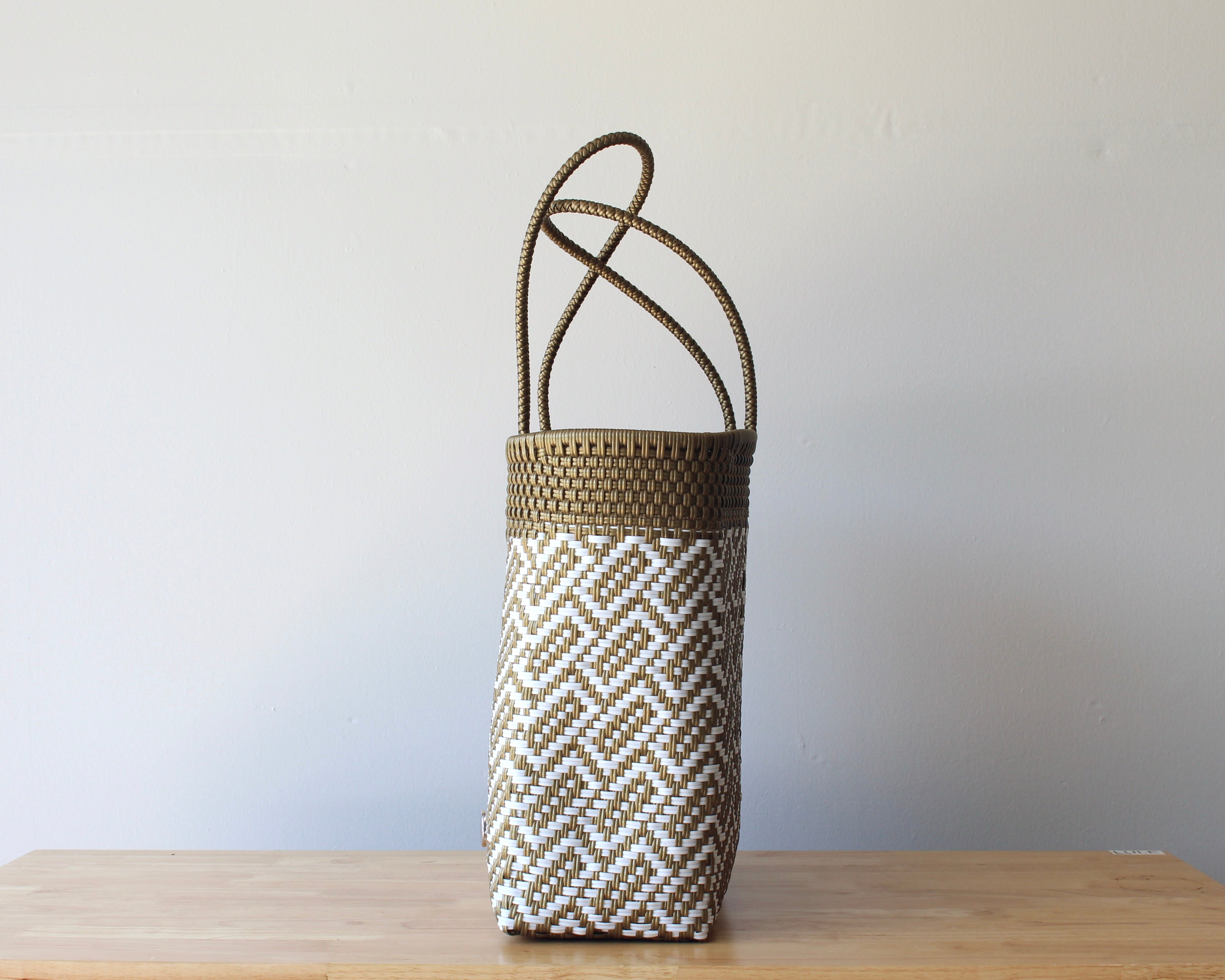 Side view of the two-tone handwoven Mexican tote — one-of-a-kind artisan bag by MexiMexi