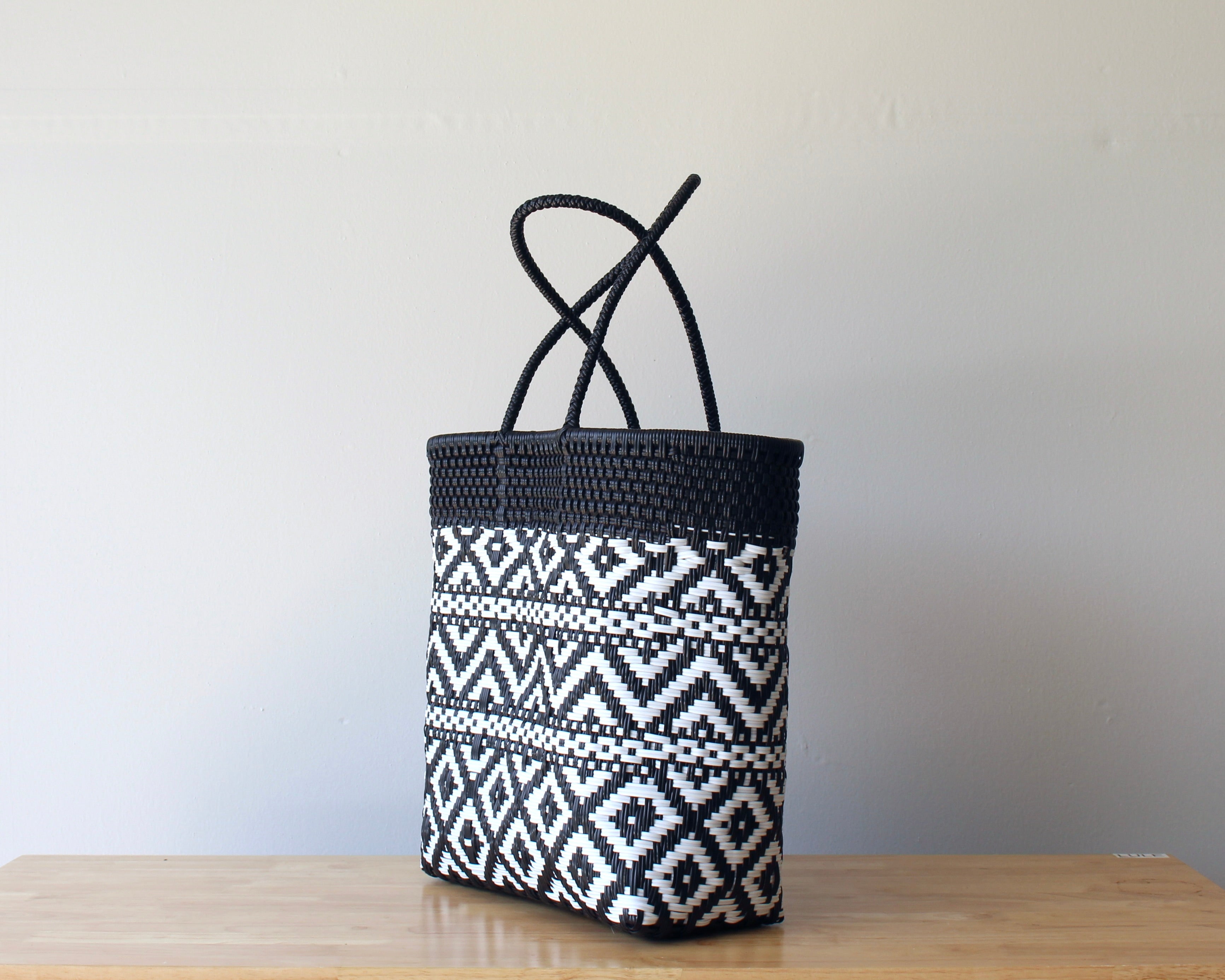 Diagonal view of two-tone woven artisan tote — waterproof MexiMexi bag