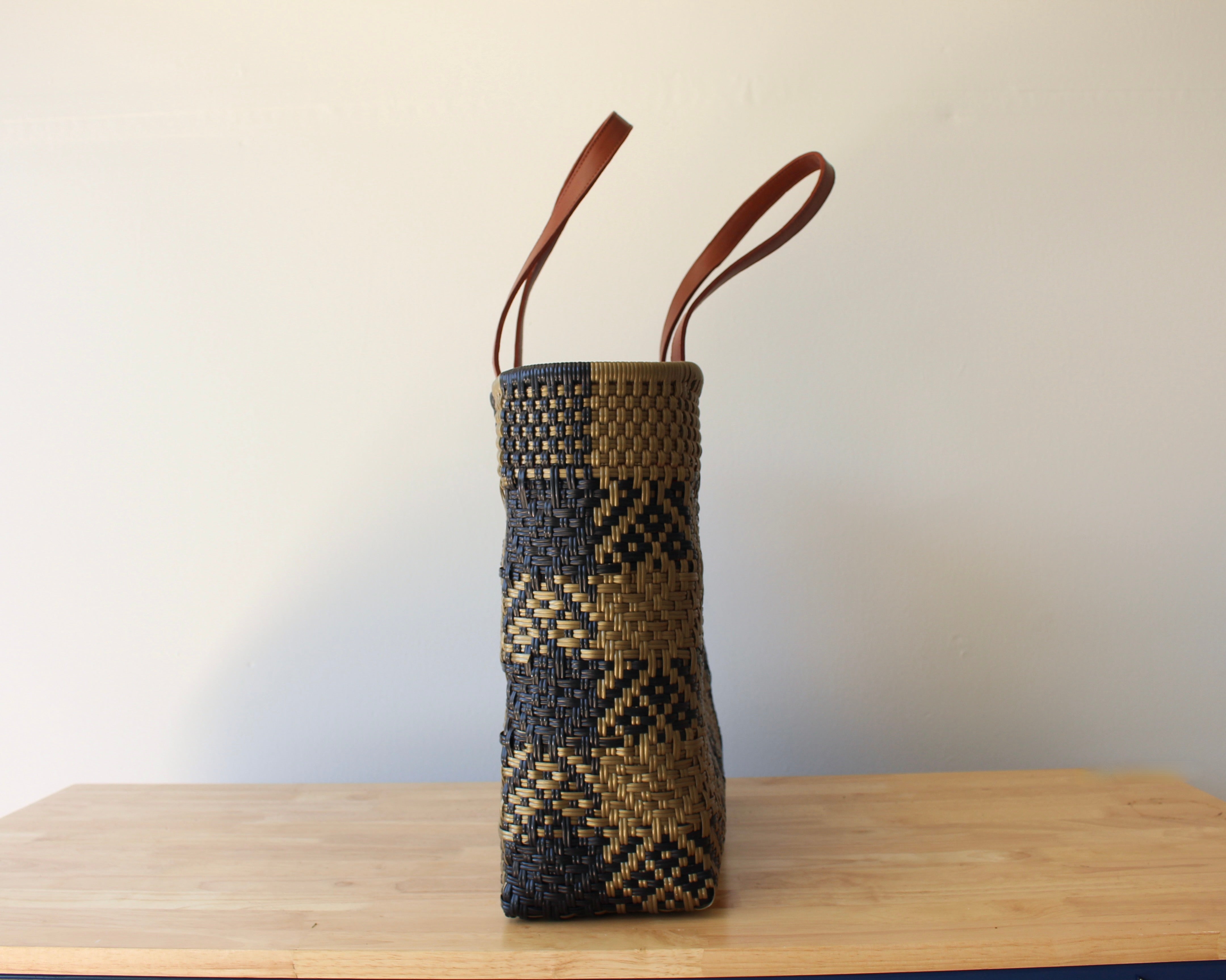 Gold and black checkered handwoven Mexican tote bag — side view showing woven texture — Alma Rosa, Domino — MexiMexi
