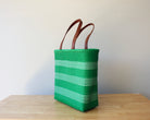 Kelly green and white handwoven Mexican tote bag with leather handles — angled view — Alma Rosa, Jade — MexiMexi